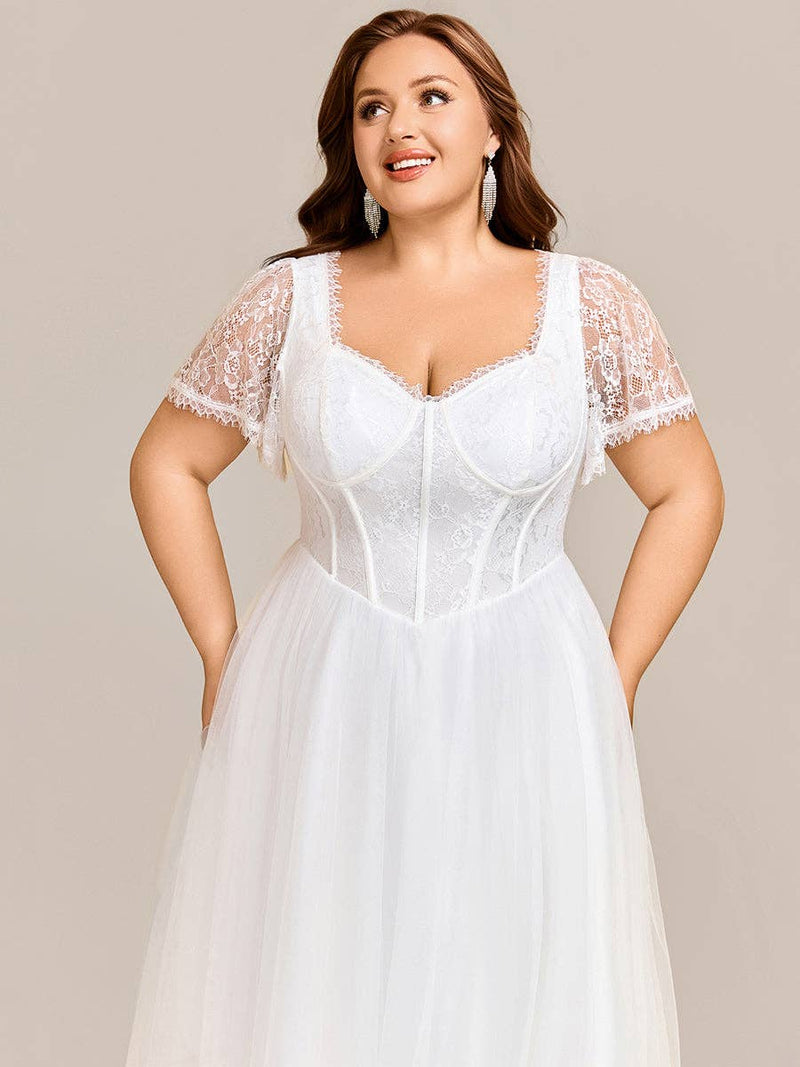 {Elegant A - Line Sweetheart Wedding Dress with Ruffle Short Sleeves & Tulle Details} - {} at {Linda Mariposa}