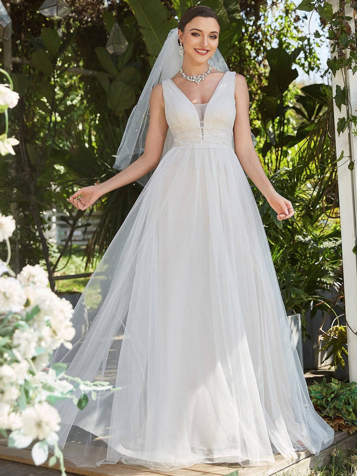 {Elegant Backless A - Line Sleeveless Ivory Wedding Dress with Deep V - Neck} - {} at {Linda Mariposa}